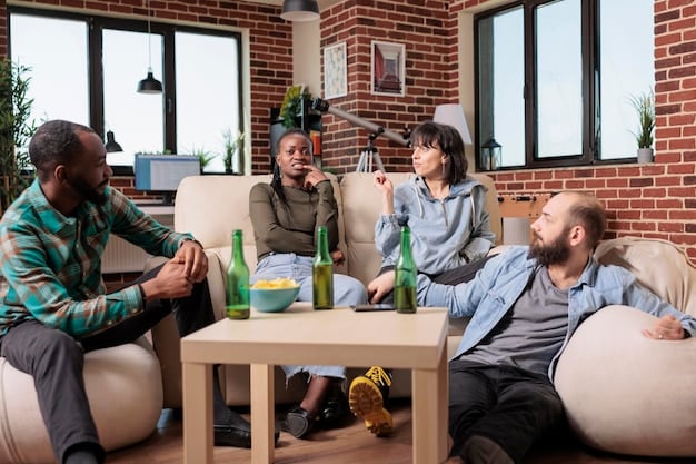 A group of colleagues taking a break together, laughing and enjoying each other's company in a comfortable lounge area of an office. The environment is relaxed and inviting.