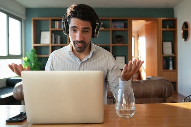 A freelancer is attending a webinar shown on a desktop computer. The webinar topic is 