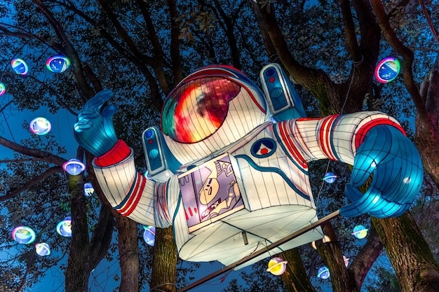 An AI robot with glowing circuits creating digital art on a holographic canvas, surrounded by various artistic mediums like music notes, film reels, and fashion sketches.