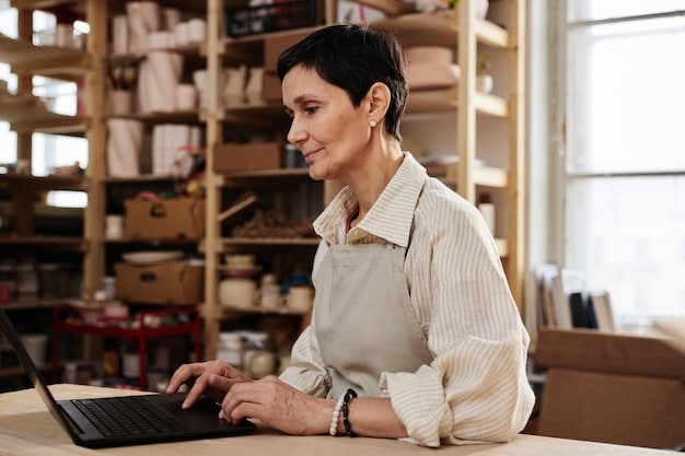 A small business owner, looking determined and working on a laptop in a cozy office setting. There are financial charts on the screen, showing an upward trend, suggesting resilience and strategic planning.