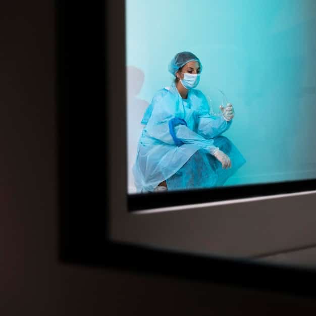 A doctor in a sterile environment conducting a remote surgery, with a holographic display showing patient data and robotic arms, illustrating the precision and connectivity enabled by 5G in healthcare.