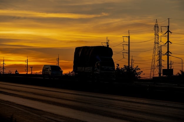 A large-scale utility-grade battery storage facility at dusk, with sunlight reflecting off the battery containers and power lines stretching into the distance. It conveys scale and grid integration.