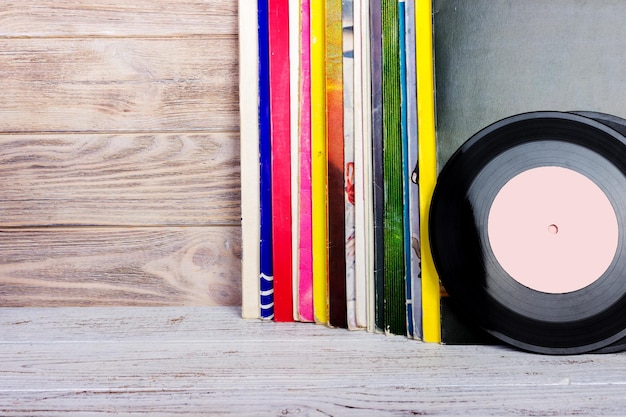 A detailed shot of vinyl records organized meticulously on a shelf, highlighting a diverse collection and the vibrant colors of album art.