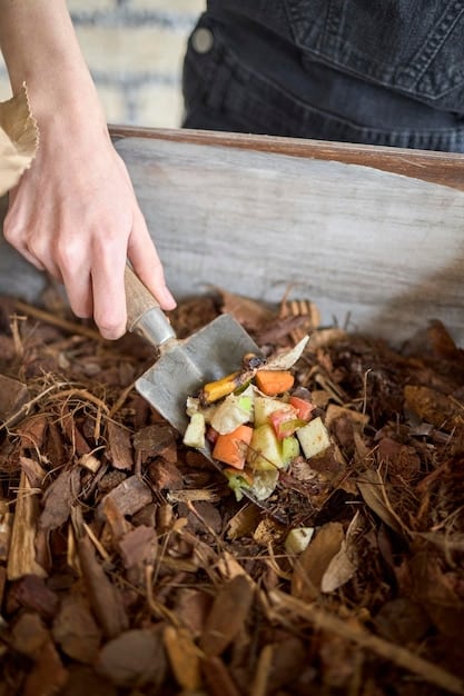 A close-up of a person composting food scraps, showing organic waste being mixed into a compost bin, highlighting waste reduction.