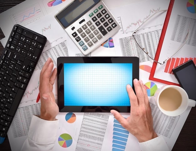 A detailed financial spreadsheet on a computer screen, with a hand holding a calculator, symbolizing careful financial analysis and business strategy.
