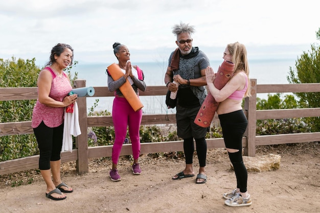 A diverse group of employees of varying ages and backgrounds engaged in a wellness activity (e.g., group stretching, healthy lunch), symbolizing the positive impact of employee benefits and wellness programs on workforce well-being.