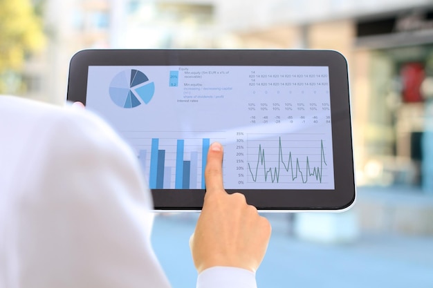 A digital dashboard displaying key performance indicators (KPIs) for telemedicine services, showing metrics like reduced patient wait times, increased patient throughput, and cost savings. Clean, modern interface with charts and graphs.