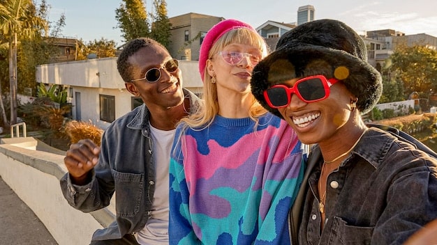 A diverse group of young adults dressed in 90s and early 2000s fashion, smiling and interacting in a city street, with retro filters applied to the image.