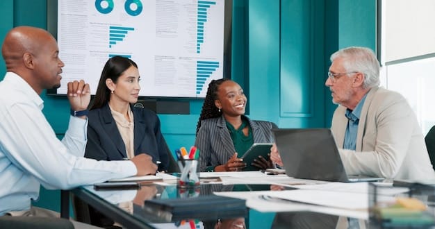 A diverse group of business professionals in a boardroom, actively discussing financial data and charts, showing strategic planning.